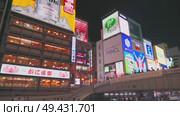 Osaka, Japan - Sep 22 2024, 4k, Panoramic view of Dotonbori street with various cafes, restaurants, bright signs and advertisements, illumination, a lot of people walking, at night, Osaka, Japan. Редакционное видео, видеограф Сергей Богомяко / Фотобанк Лори