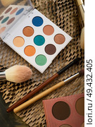 fashion set of new cosmetics palettes with  brushes. close up. Стоковое фото, агентство Ingram Publishing / Фотобанк Лори