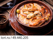 Seafood soup with prawns, mussels and fish. Tom Yam soup with seafood. Стоковое фото, агентство Ingram Publishing / Фотобанк Лори