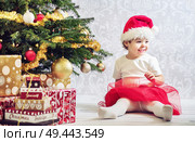Portrait of a cute girl dressed up a santa. Стоковое фото, агентство Ingram Publishing / Фотобанк Лори