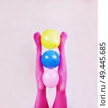  Pop art about legs wearing pink tights and holding balloons                              . Стоковое фото, агентство Ingram Publishing / Фотобанк Лори