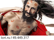 Portrait of a skinny handsome man taken by lots of women. Стоковое фото, агентство Ingram Publishing / Фотобанк Лори