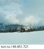 Scenic view of ski slope in Pirin mountains above the clouds. Стоковое фото, агентство Ingram Publishing / Фотобанк Лори