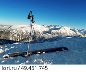 Ski equipment on the top of Todorka peak with a view to snow covered Pirin Mountains. Стоковое фото, агентство Ingram Publishing / Фотобанк Лори