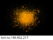 Freeze motion of colorful yellow powder exploding isolated on black dark background. Abstract design of color dust cloud. Particles explosion screen saver, wallpaper, brush. Universe creation concept. Стоковое фото, агентство Ingram Publishing / Фотобанк Лори