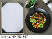 Beautiful and tasty gourmet food with menu . Стоковое фото, агентство Ingram Publishing / Фотобанк Лори