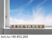 Proactive sign in a window sill on a bright day with a blue sky outside. Стоковое фото, агентство Ingram Publishing / Фотобанк Лори