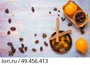 blue wooden background with cinnamon, anise, dog rose  and lemon. Стоковое фото, агентство Ingram Publishing / Фотобанк Лори