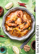 Traditional thai cuisine.Tom yum goong.Spicy shrimp soup. Spicy soup with seafood. Стоковое фото, агентство Ingram Publishing / Фотобанк Лори