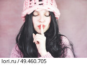 Beautiful brunette women doing silent gesture                               . Стоковое фото, агентство Ingram Publishing / Фотобанк Лори