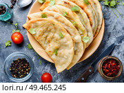 Cheburek, unleavened patty stuffed with minced meat.Caucasian cuisine -cheburek with meat. Cheburek,dough pie with meat filling. Стоковое фото, агентство Ingram Publishing / Фотобанк Лори