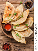 Cheburek, unleavened patty stuffed with minced meat.Caucasian cuisine -cheburek with meat. Cheburek,dough pie with meat filling. Стоковое фото, агентство Ingram Publishing / Фотобанк Лори