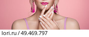 Beauty Woman with perfect Makeup and Manicure. Glamour Girl with Jewelry. Pink Lips and Nails. Precious Stones and Silver. Beauty girls Face isolated on light Background. Fashion photo. Стоковое фото, агентство Ingram Publishing / Фотобанк Лори