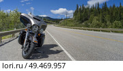 Motorcycle parked at roadside, David Thompson Highway, Clearwater County, Alberta, Canada. Стоковое фото, агентство Ingram Publishing / Фотобанк Лори