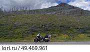 Motorcycle parked at roadside, David Thompson Highway, Clearwater County, Alberta, Canada. Стоковое фото, агентство Ingram Publishing / Фотобанк Лори