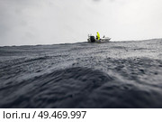 Sea with boat in the background, Majestic Point, Belize Barrier Reef, Belize. Стоковое фото, агентство Ingram Publishing / Фотобанк Лори