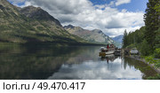 Lake with mountain range in the background, Waterton Lake, Waterton-Glacier International Peace Park, Waterton Lakes National Park, Alberta, Canada. Стоковое фото, агентство Ingram Publishing / Фотобанк Лори