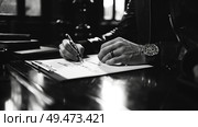 A person sitting down and writing on a white piece of paper with a pen, focusing on the task at hand. Стоковое AI-изображение, AI-художник Данила Большаков / Фотобанк Лори
