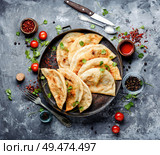 Cheburek, unleavened patty stuffed with minced meat.Traditional Tatar pastry. Cheburek,dough pie with meat filling. Стоковое фото, агентство Ingram Publishing / Фотобанк Лори