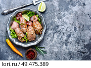 Grilled squid stuffed with vegetables.Seafood.Food background.Fried calamari. Grilled squid with vegetables. Стоковое фото, агентство Ingram Publishing / Фотобанк Лори