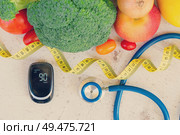 raw vegetables with blood glucose meter and stethoscope, , diabetes healthy diet concept, toned. Diabetes healthy diet. Стоковое фото, агентство Ingram Publishing / Фотобанк Лори