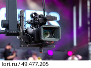 Professional video camera on a crane during an outdoor event. Стоковое фото, фотограф Евгений Ткачёв / Фотобанк Лори