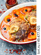 Ossobuco,traditional dish of Italian cuisine.Prepared osso buco veal. Ossobuco beef with apricot. Стоковое фото, агентство Ingram Publishing / Фотобанк Лори