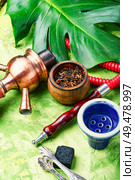 Hookah mouthpiece.Shisha aroma.Tabak with tropical flavor.Kalian smoking. Arabia shisha with tobacco. Стоковое фото, агентство Ingram Publishing / Фотобанк Лори