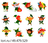 Elf winter season helper of Santa Claus set vector. Girl and boy wearing costumes and hats, opening presents gifts and riding sledges eating lollipop. Elf Winter Season Helper of Santa Claus Vector. Стоковая иллюстрация, агентство Ingram Publishing / Фотобанк Лори