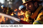 Firefighters battling flames in wildfire at sunset with focused determination and teamwork. Стоковое AI-изображение, AI-художник Сергей Толмачёв / Фотобанк Лори