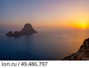 Es Vedra islet sunset in Sant Josep of Balearic Islands. Стоковое фото, агентство Ingram Publishing / Фотобанк Лори
