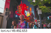 Osaka, Japan - Sep 21 2024, 4k, Panoramic view of Dotonbori street with various cafes, restaurants, bright signs and advertisements, illumination, a lot of people walking, at night, Osaka, Japan. Редакционное видео, видеограф Сергей Богомяко / Фотобанк Лори