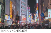 Osaka, Japan - Sep 21 2024, 4k, Panoramic view of Dotonbori street with various cafes, restaurants, bright signs and advertisements, illumination, a lot of people walking, at night, Osaka, Japan. Редакционное видео, видеограф Сергей Богомяко / Фотобанк Лори