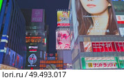 Osaka, Japan - Sep 22 2024, 4k, Panoramic view of Dotonbori street with various cafes, restaurants, bright signs and advertisements, illumination, a lot of people walking, at night, Osaka, Japan. Редакционное видео, видеограф Сергей Богомяко / Фотобанк Лори