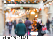Beautiful Christmas background 2026.Abstract blurred Christmas background with Christmas tree garlands in warm shades. Стоковое фото, фотограф Photojuli / Фотобанк Лори