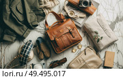 Assorted items are spread out on a table, creating a cluttered yet organized scene. Стоковое AI-изображение, AI-художник Данила Большаков / Фотобанк Лори