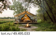 A tent set up in a field with a fire pit burning in the center, creating a cozy camping spot under the open sky. Стоковое AI-изображение, AI-художник Данила Большаков / Фотобанк Лори