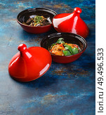 Chicken and liver dishes cooked in tagine. Traditional way of cooking food in Arab countries. Стоковое фото, фотограф Ирина Буракова / Фотобанк Лори