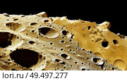A detailed view of a rock showing numerous holes and crevices formed through natural processes like erosion and weathering. Стоковое AI-изображение, AI-художник Данила Большаков / Фотобанк Лори