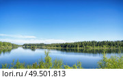 Lake scene with vibrant colors in green and blue in the summertime. Стоковое фото, агентство Ingram Publishing / Фотобанк Лори