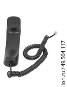 Чёрная телефонная трубка с витым проводом на белом фоне. A black handset with a twisted wire on a white background. Стоковое фото, фотограф Татьяна Д / Фотобанк Лори