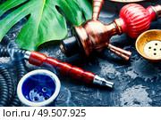 Smoking hookah.Details of Turkish hooka.Shisha with a fruity aroma of tobacco.. Oriental smoking hookah. Стоковое фото, агентство Ingram Publishing / Фотобанк Лори