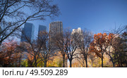New York City Manhattan Central Park panorama in Autumn lake with skyscrapers and colorful trees with reflection. Стоковое фото, агентство Ingram Publishing / Фотобанк Лори