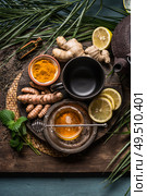 Preparation of Turmeric ginger tea with fresh ingredients, top view. Healthy herbal immune boosting. Стоковое фото, агентство Ingram Publishing / Фотобанк Лори