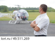 a businessman next to helicopter. Стоковое фото, агентство Ingram Publishing / Фотобанк Лори