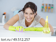 a woman scrubbing work surface. Стоковое фото, агентство Ingram Publishing / Фотобанк Лори