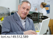 portrait of a smiling man in workshop. Стоковое фото, агентство Ingram Publishing / Фотобанк Лори
