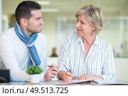 office workers talking about guidelines to project. Стоковое фото, агентство Ingram Publishing / Фотобанк Лори