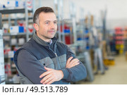 portrait of man in stores wearing gilet. Стоковое фото, агентство Ingram Publishing / Фотобанк Лори