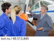 portrait of apprentices and propeller of an airplane. Стоковое фото, агентство Ingram Publishing / Фотобанк Лори